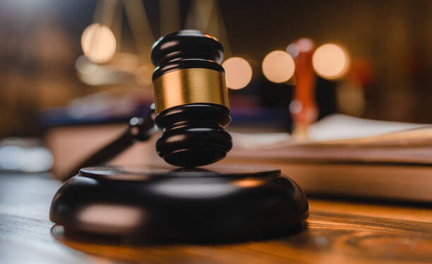 Court gavel representing the conviction of 21 companies over unlicensed investment operations in Nigeria.