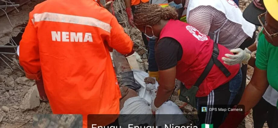 Rescue workers search debris after building collapse in Enugu