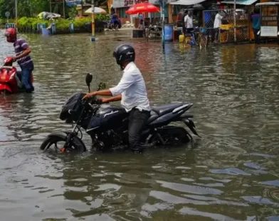Flooded road in Ogun State as government issues fresh flood alert.