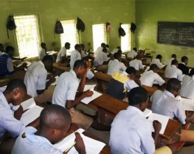 Students writing an examination in a hall as FG proposes a harmonised 2027 examination timetable.