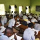 Students writing an examination in a hall as FG proposes a harmonised 2027 examination timetable.