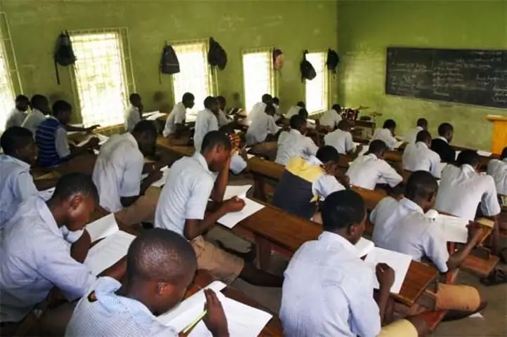 Students writing an examination in a hall as FG proposes a harmonised 2027 examination timetable.